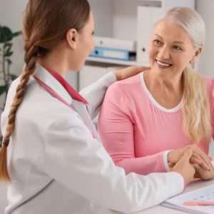 Doctor discussing menopause treatment options with patient in Dubai clinic